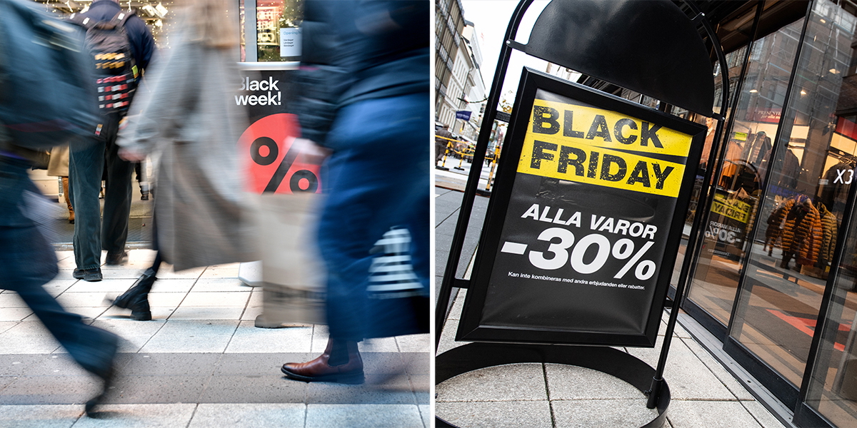 Folk rusar förbi en skylt om Black Week och en skylt om Black Friday säger att alla varor är nedsatta med 30 procent.