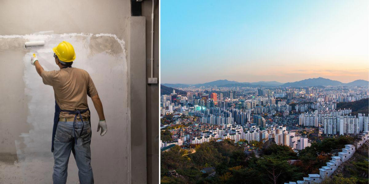 En man jobbar som målare och Sydkoreas huvudstad Seouls skyline.